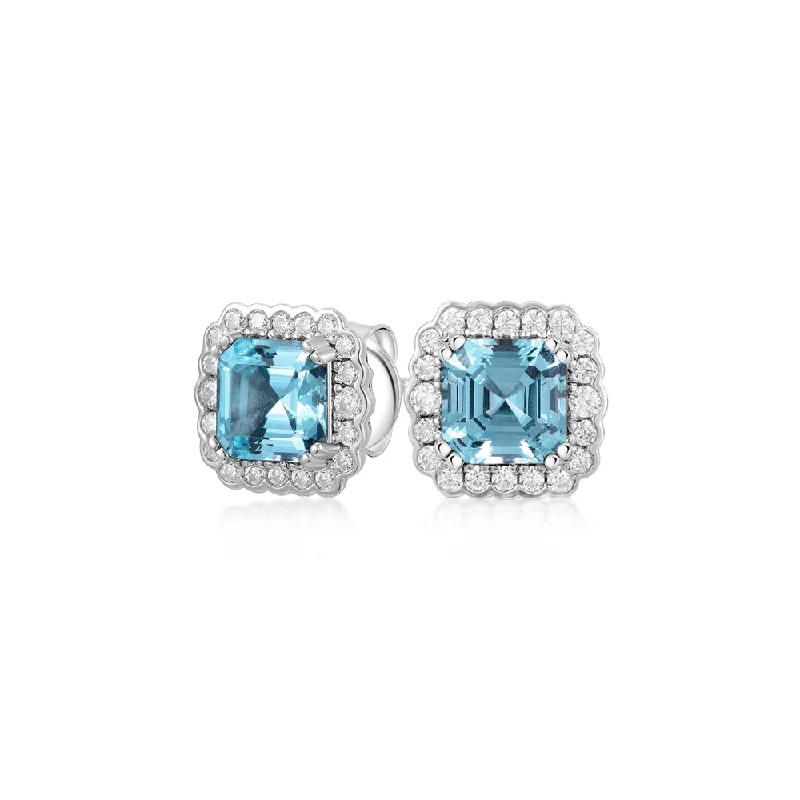 Unmissable Discounts On Timeless Jewelry Pieces Asscher and Round Brilliant halo stud earrings with blue topaz simulants and 0.42 carats* of diamond simulants in sterling silver Unmissable Discounts On Timeless Jewelry Pieces Asscher and Round Brilliant halo stud earrings with blue topaz simulants and 0.42 carats* of diamond simulants in sterling silver