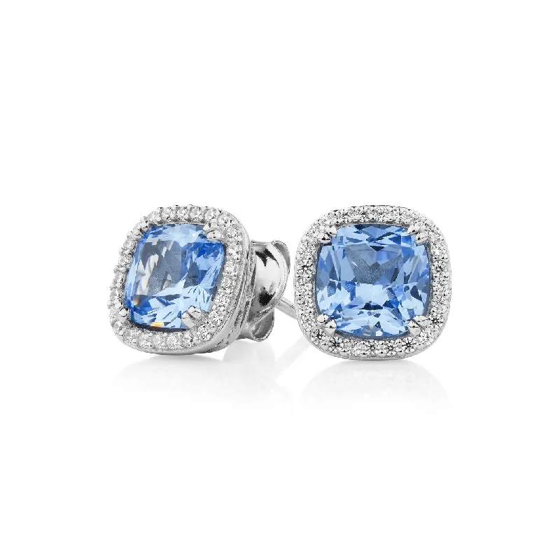 Elevate Your Outfit With Discounted Statement Jewelry Cushion and Round Brilliant halo stud earrings with blue topaz simulants and 2.81 carats* of diamond simulants in sterling silver Elevate Your Outfit With Discounted Statement Jewelry Cushion and Round Brilliant halo stud earrings with blue topaz simulants and 2.81 carats* of diamond simulants in sterling silver